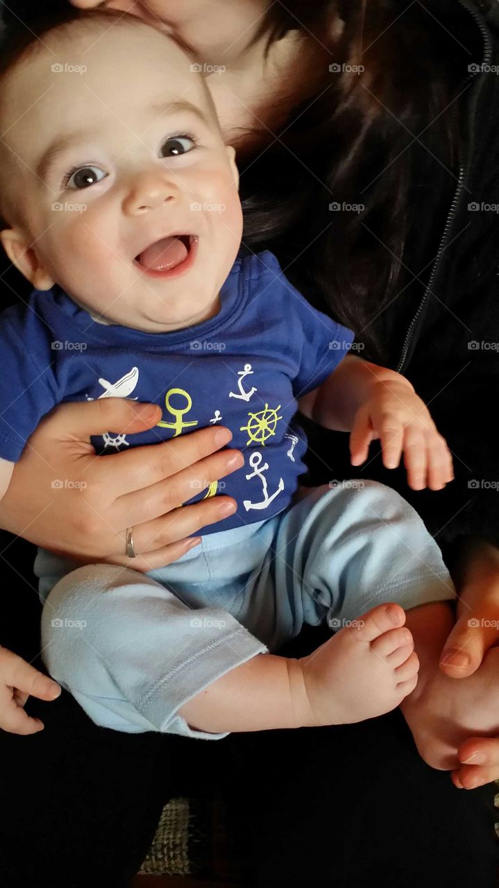 Baby laughing in mother's arms!