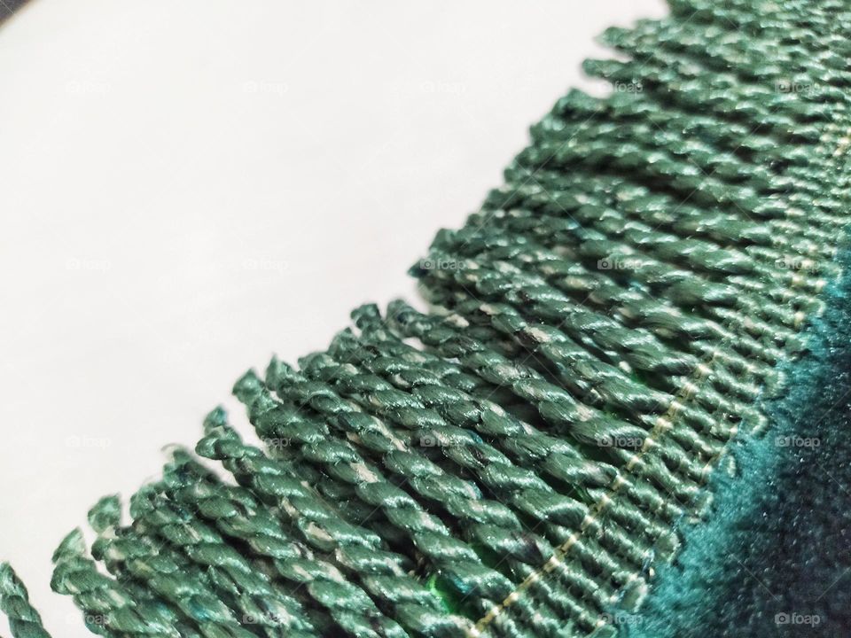 The end of the prayer mat with tassel