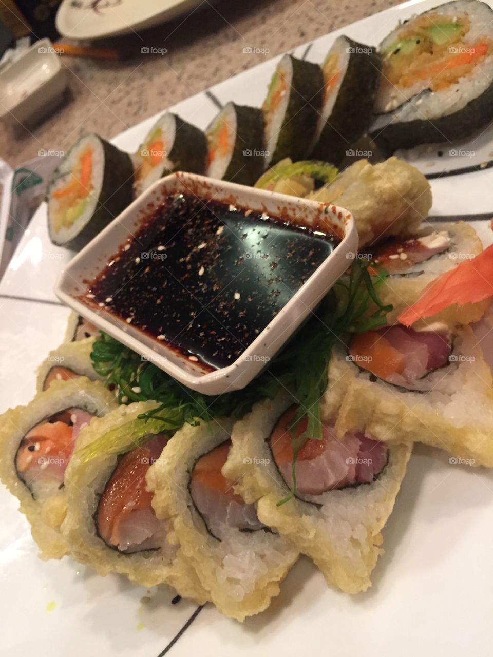 Sushi dinner with soy dipping sauce at Japanese restaurant 