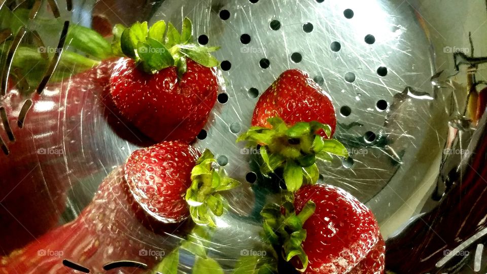 Close-up of strawberries in colander