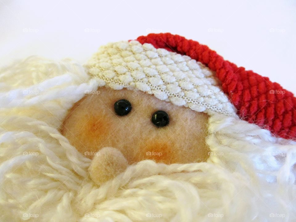 Santa Claus face. Santa face of felt and yarn