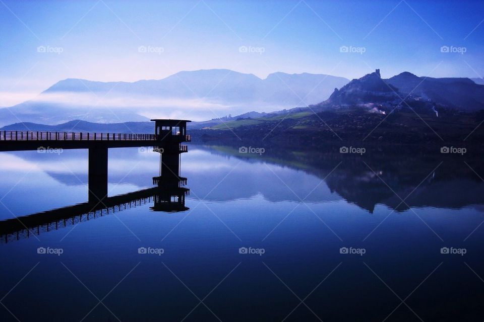 Reflection of bridge in lake