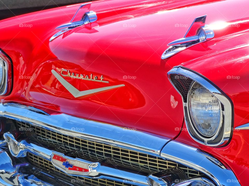 Classic Red Chevrolet. Detail Of Front Grille And Chrome Of 1955 Chevy Bel Air
