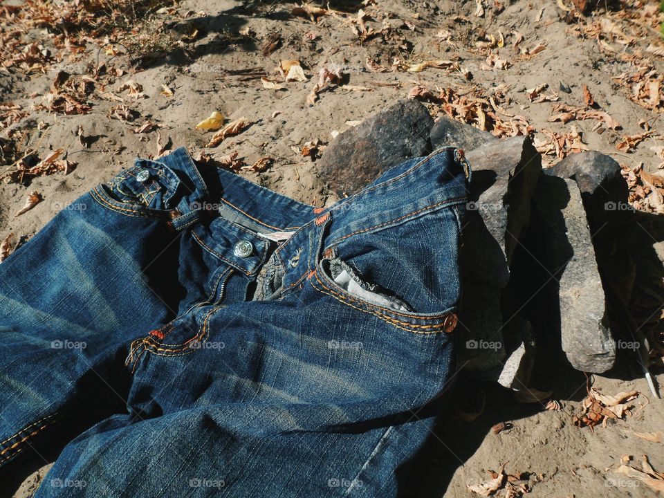 Jeans lie on the sand