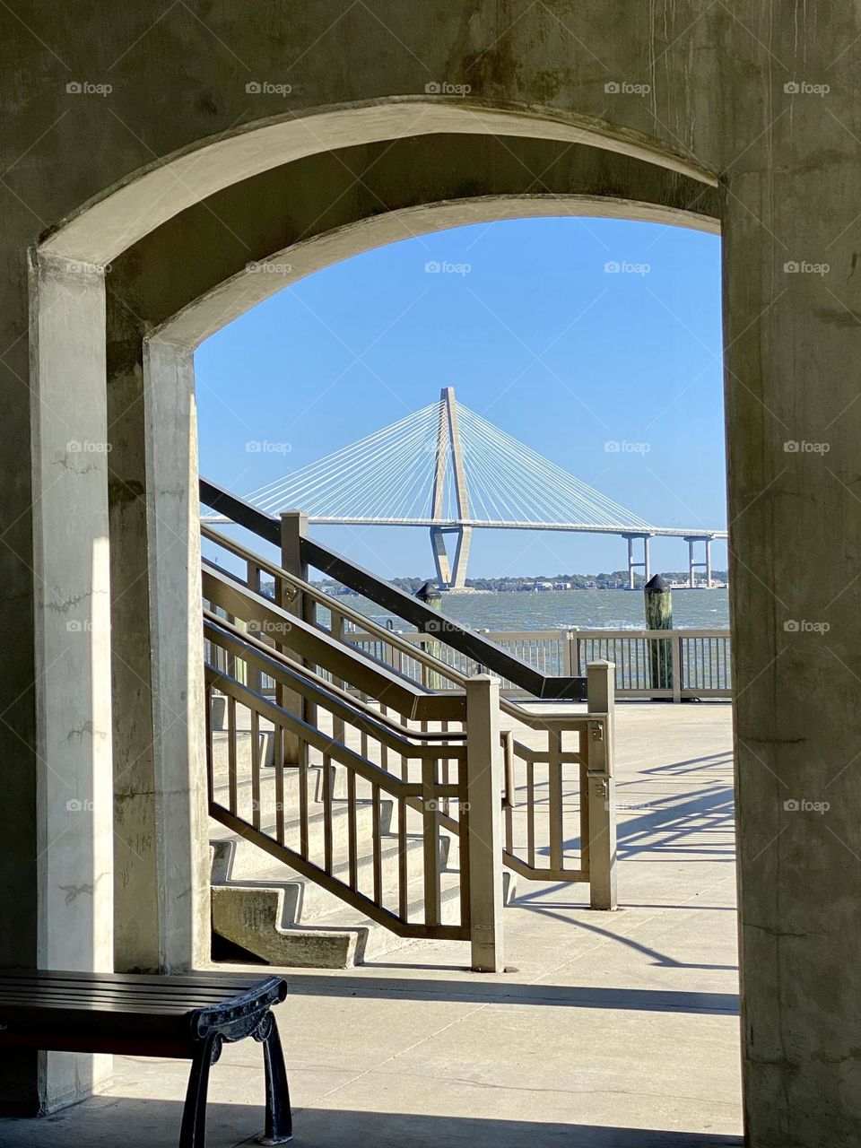 Looking through an archway towards a bridge