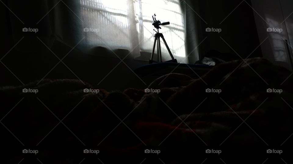 Suporte de câmera e celular para fotografar.