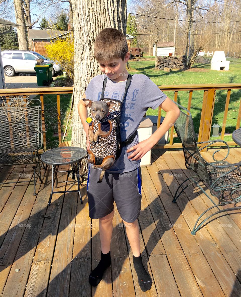 Boy with doggy pouch