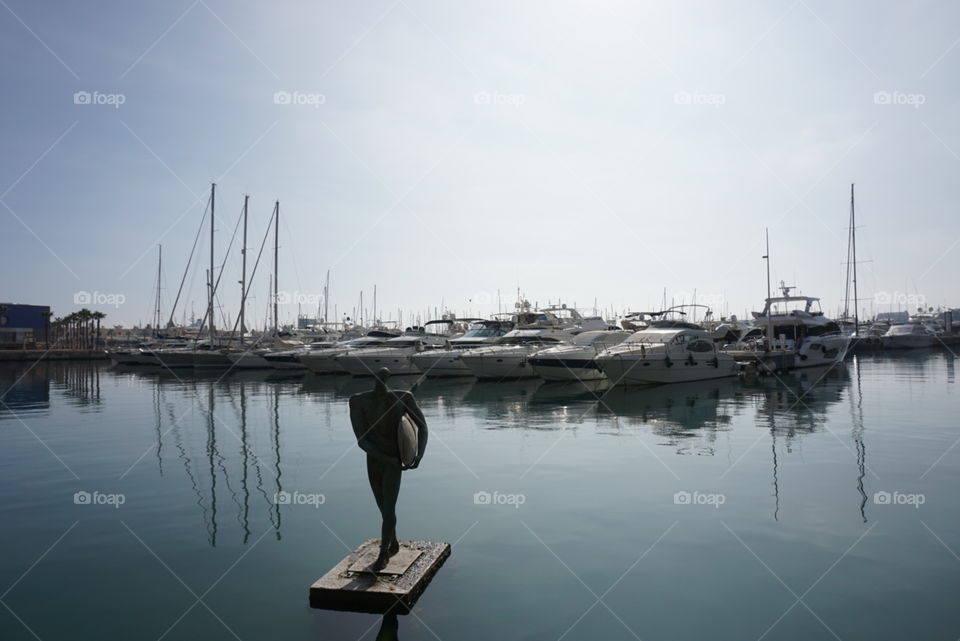 Port#touristic#sea#boats#statue#travelphotos#sky