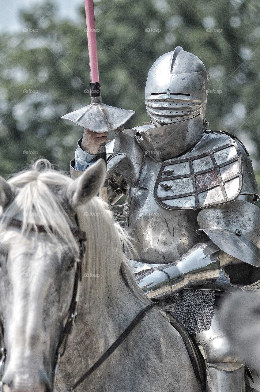 Knight prepares for battle at local Renaissance festival. 