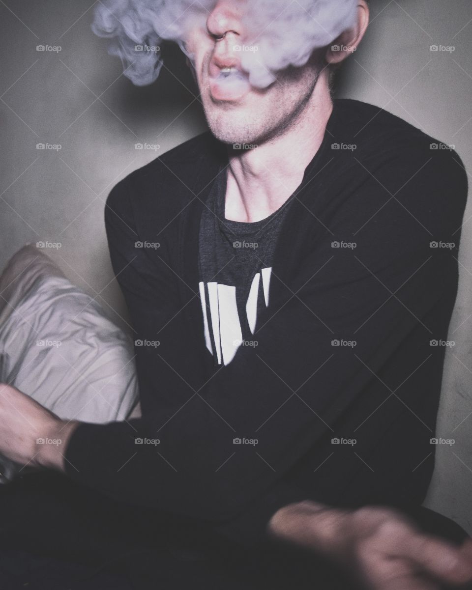 Person breathing out smoke