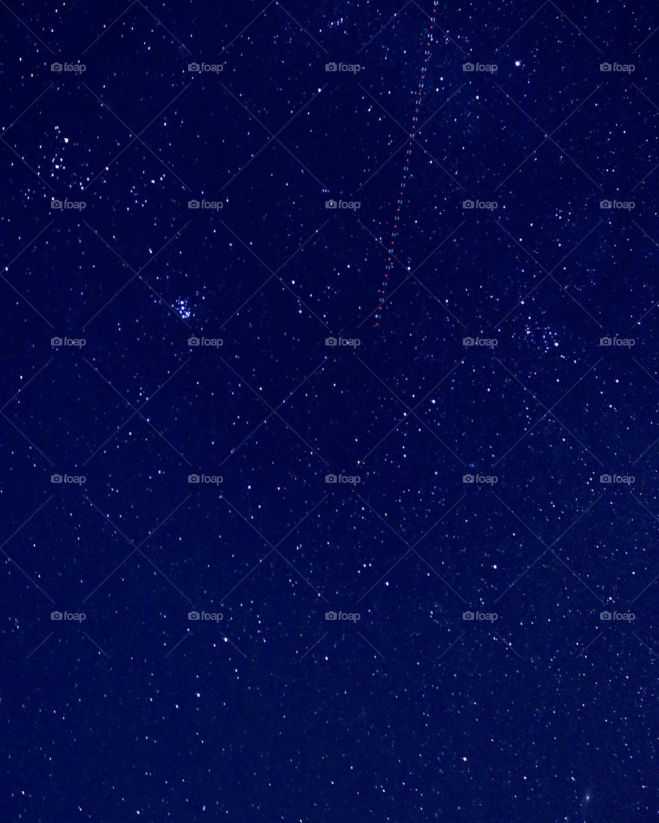 Looking up at the covering stars and a passing spaceship