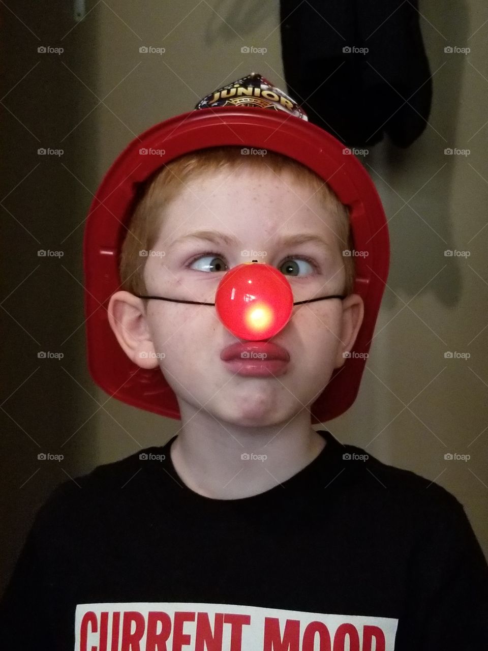 silly grandson in light up nose