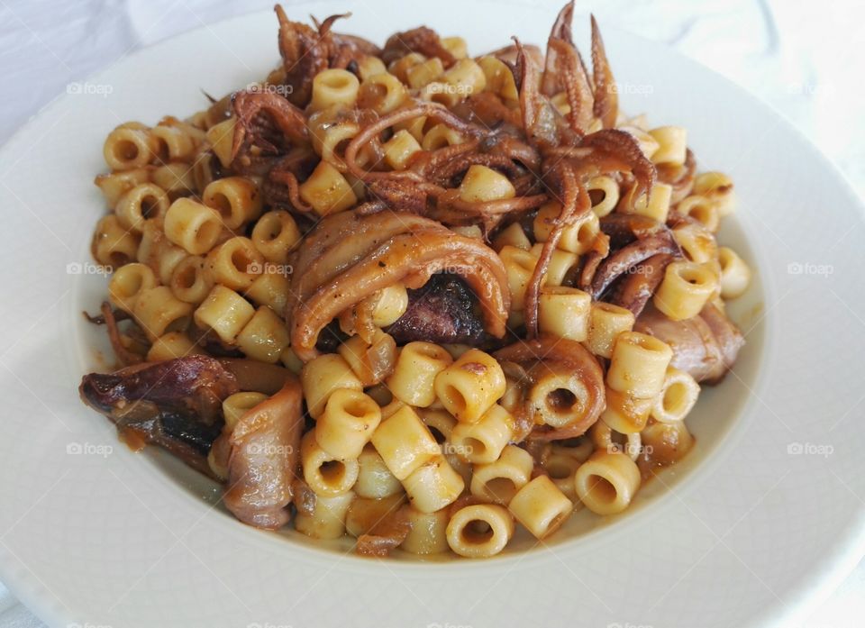 macaroni with squid and tomato sauce, Clean Monday food in Greece, closeup