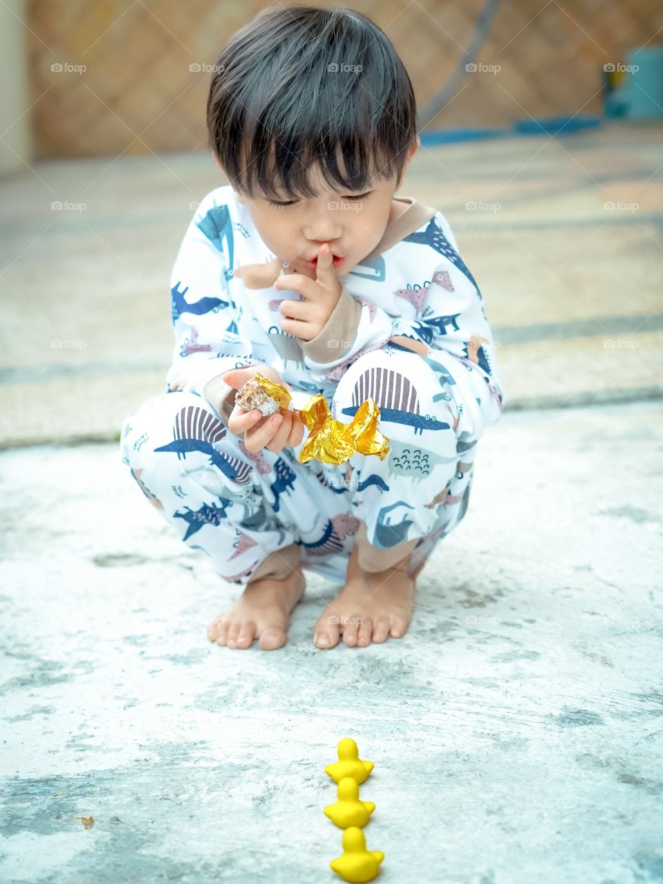 He played with his duck stuffed with laughter