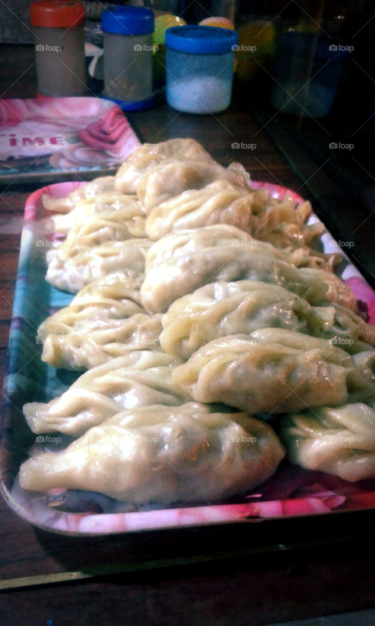 Fried & Steamed chicken momos,one of the best selling tasty streetfoods in India.