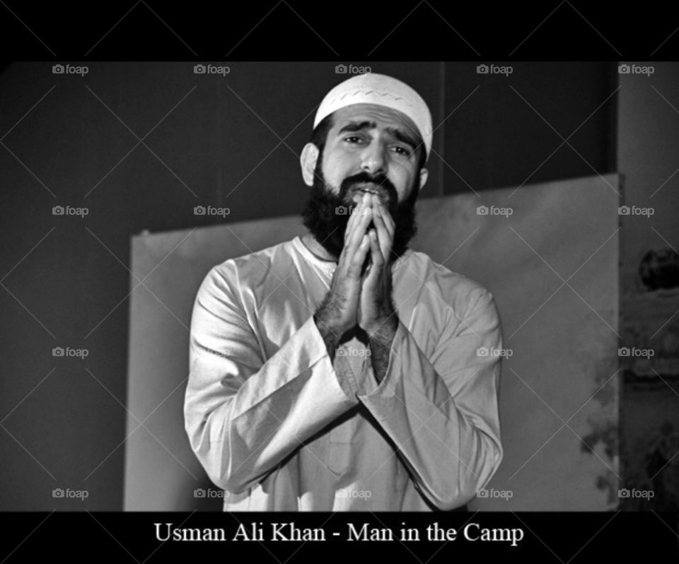Man in the camp. Photo of a theatrical performance. The act is called Man in the Camp. 