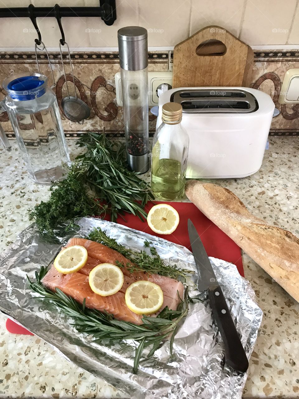 cooking dinner, red fish with herbs and lemon