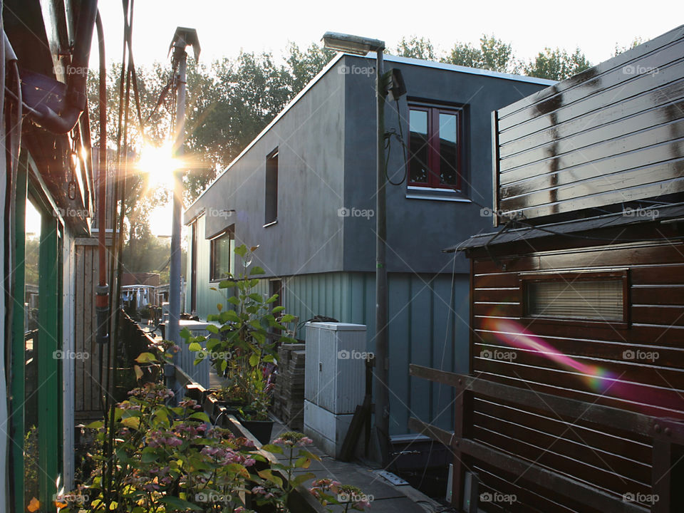 Houseboat with prisma and pink sunlight