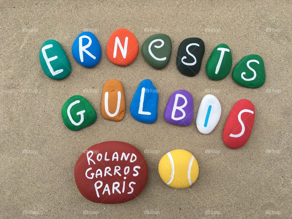 Ernests Gulbis, lithuanian professional tennis player at Roland Garros, souvenir on stones 