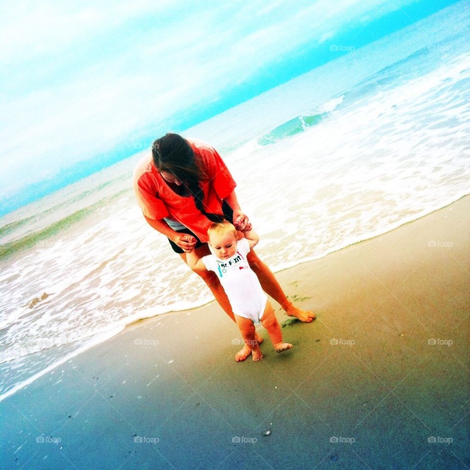 Baby and mommy on the beach