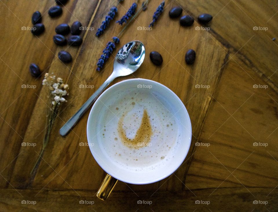 Coffee from above with silver spoon and coffee beans