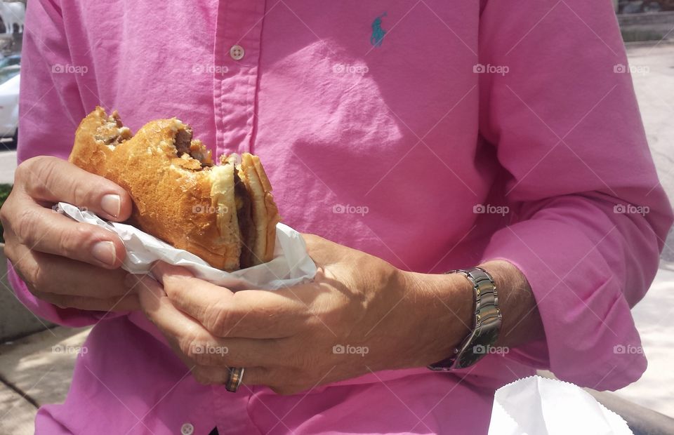 Hands Holding Hamburger