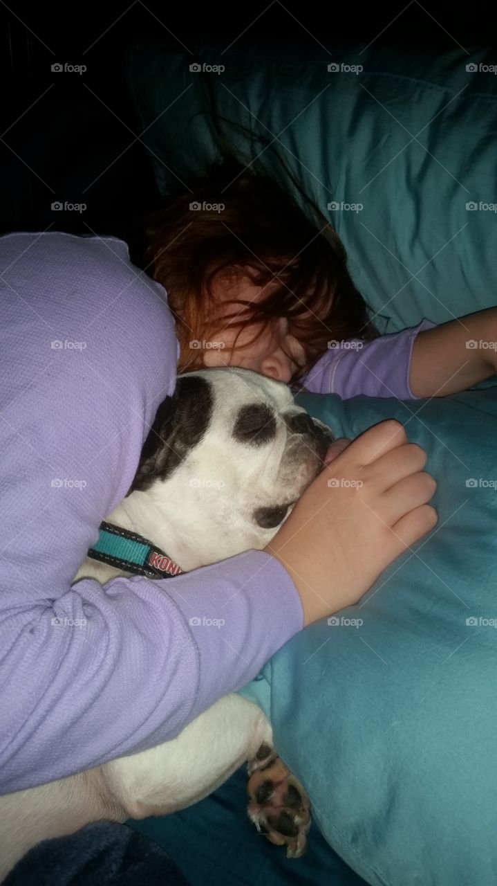 A Kid and Her Dog Snuggle Up On Christmas  Eve Morning