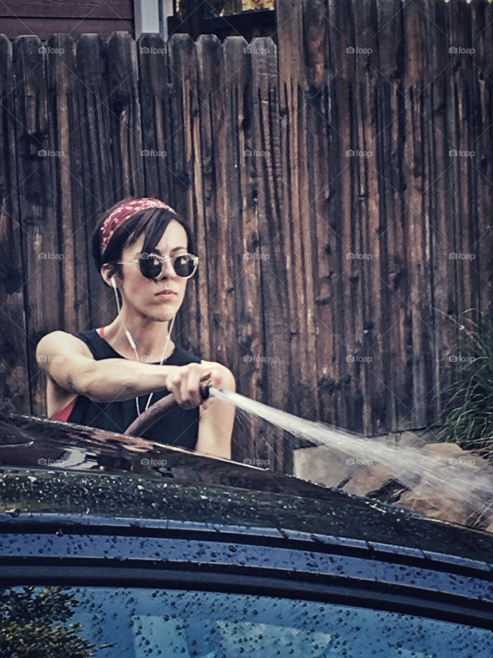 Woman washing car