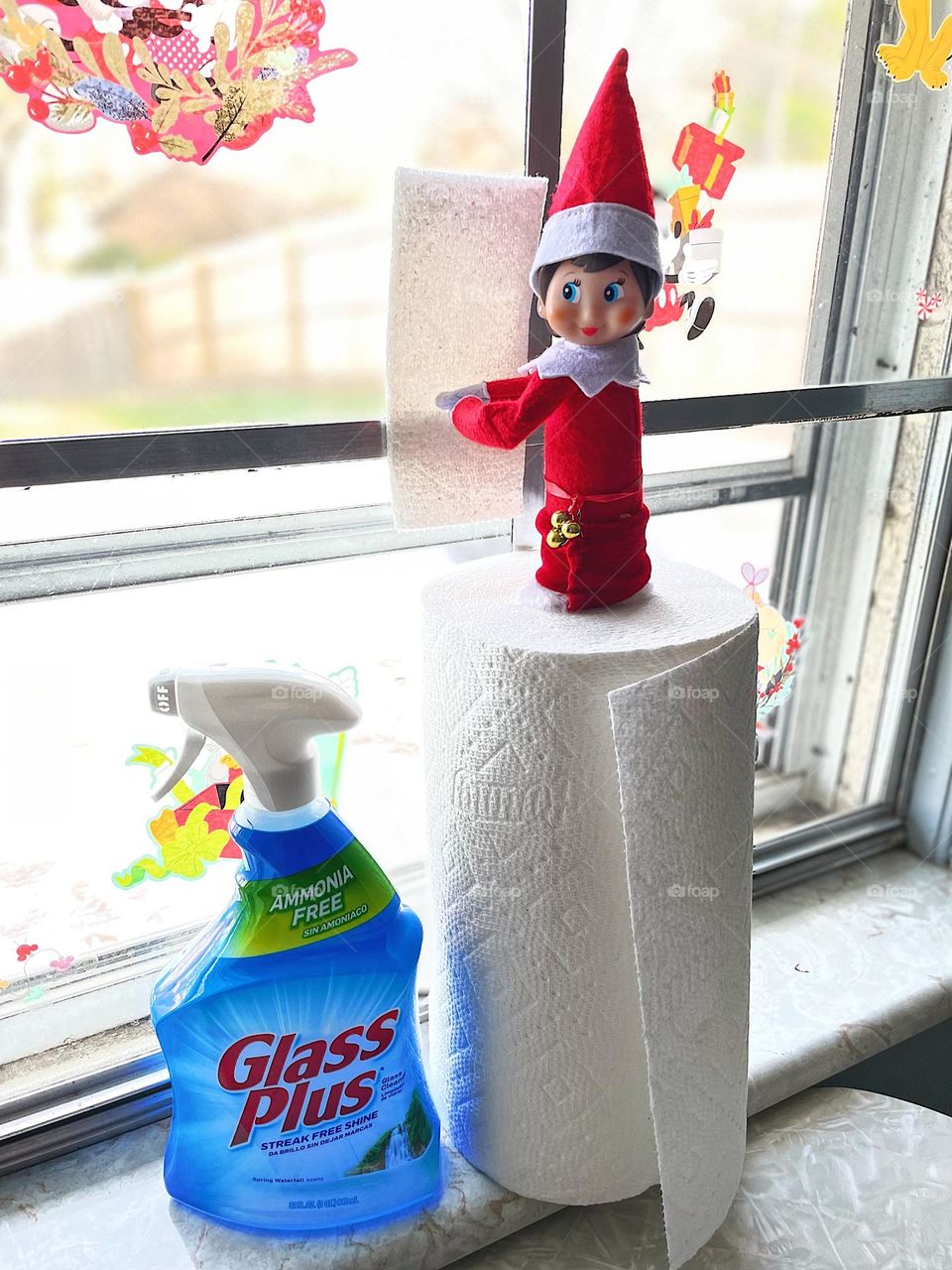 Elf on the Shelf cleaning the windows, cleaning the window with Glass Plus window cleaner, Elf on the Shelf helps clean the windows, people in windows, cleaning up the house, looking through the windows 