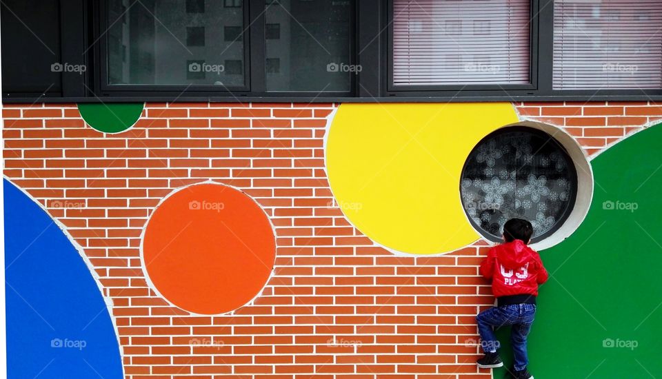 a child looking through a window
