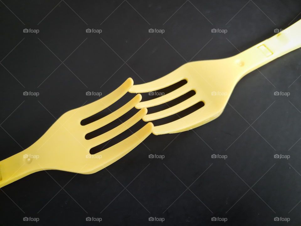 Yellow Forks on a black background