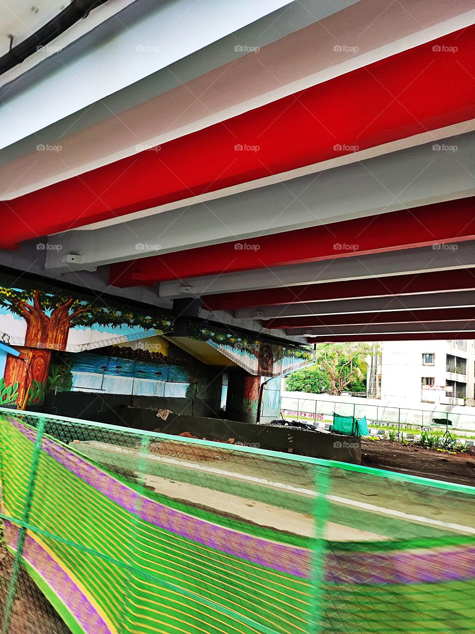 Under the Flyover
Amazing Wall  Painting 🖌️🖌️
Traditional Indian Hut🏡 Scene 
 Colourful Stripes On Rooftop