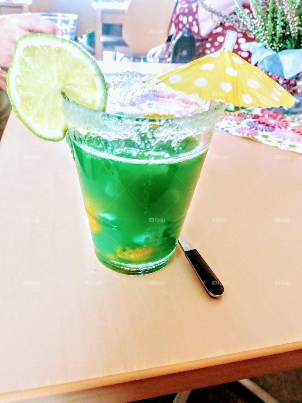 green cocktail at a summer party