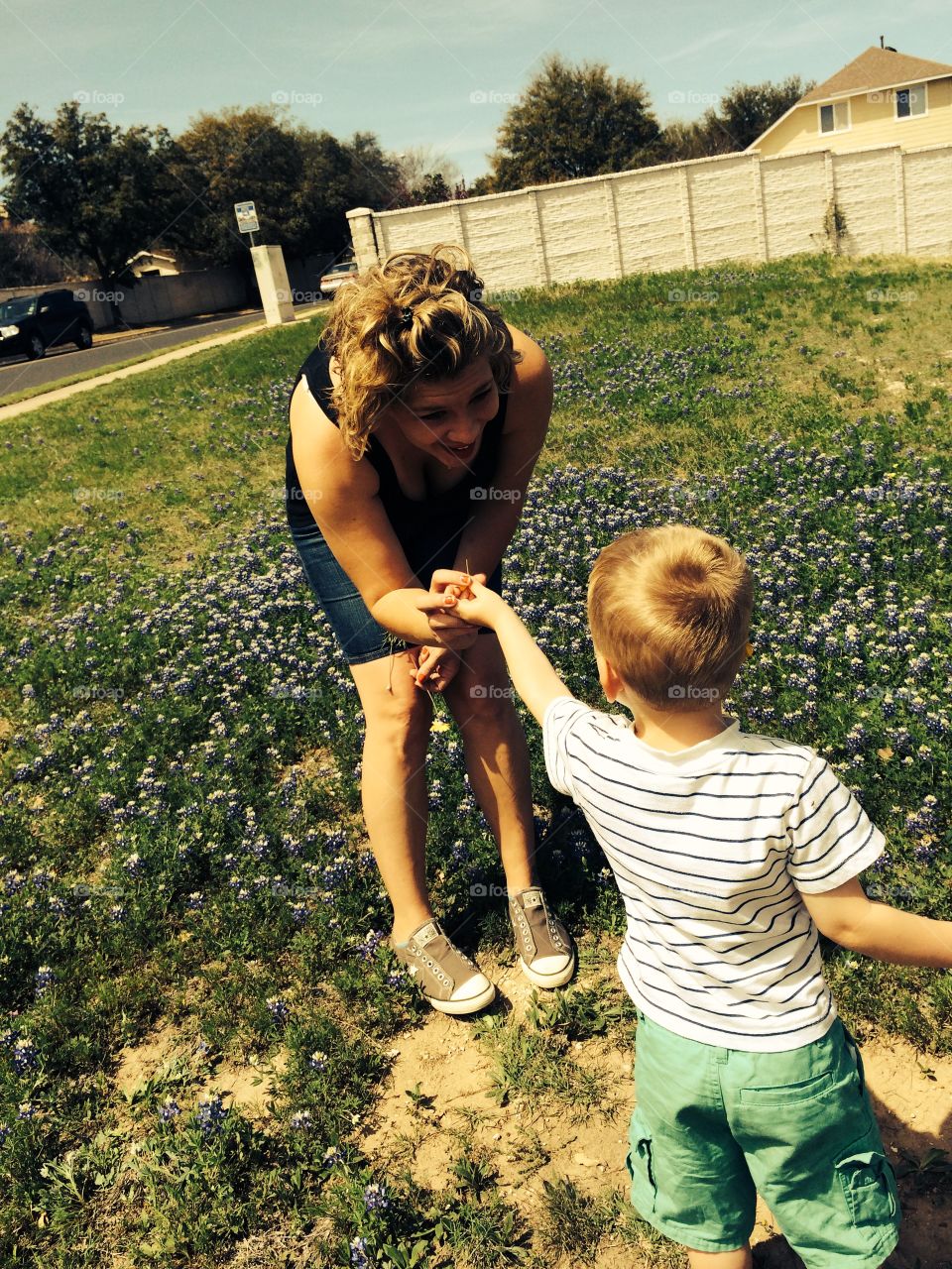 Mom love. A friend and her son picking flowers. 