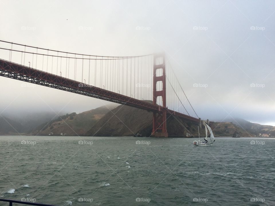 Golden Gate Bridge, late afternoon on a foggy day, seen from San Francisco Bay. 