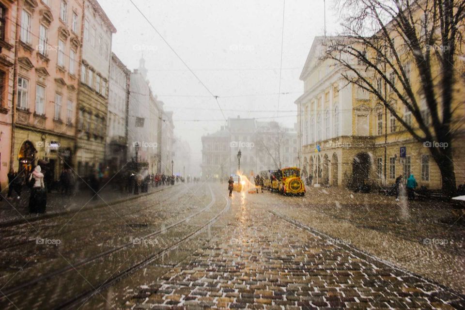 Lviv, Ukraine. Snow. Square. Train.