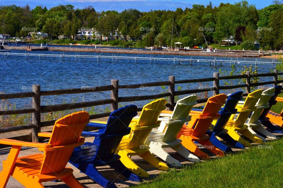 Summer color with chairs by the lake