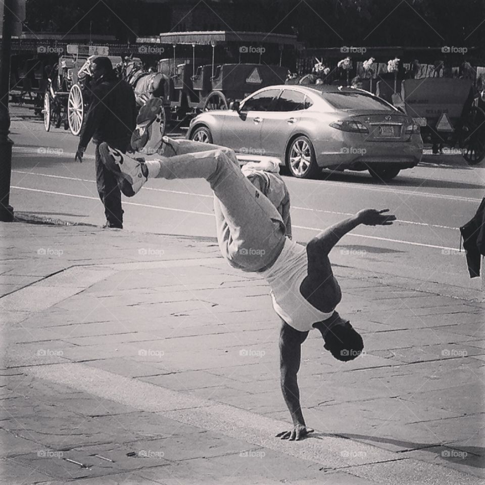 A bboy in New Orleans. A bboy (breakdancer) performing on the streets of New Orleans. 