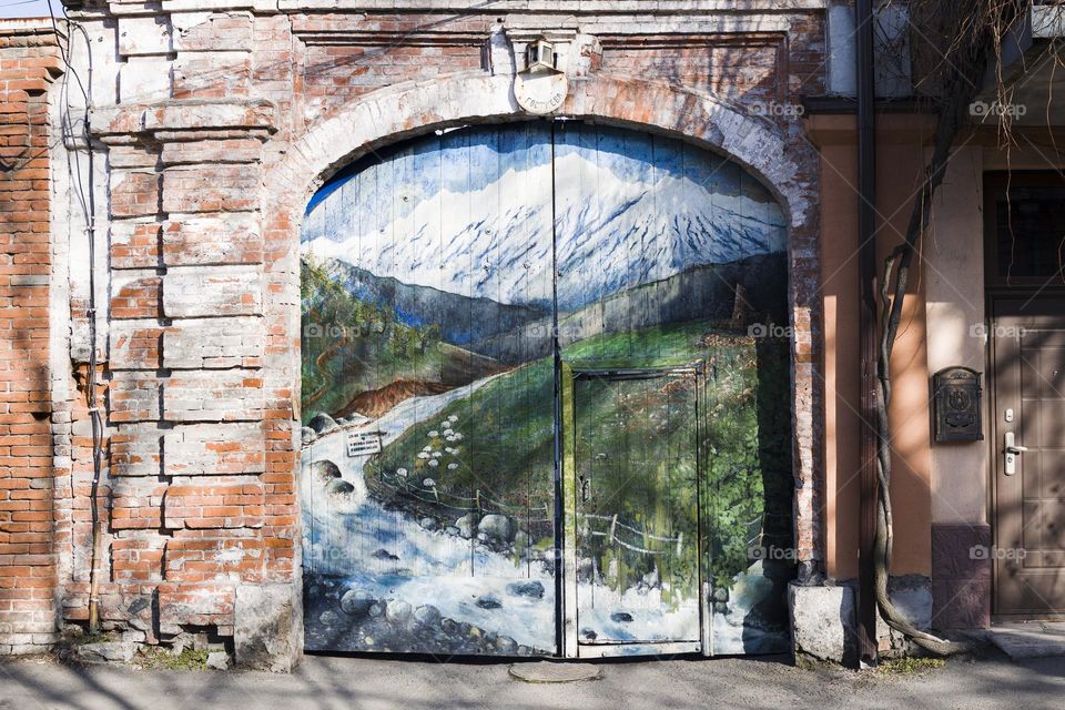 Home gate with decorative picture of nature