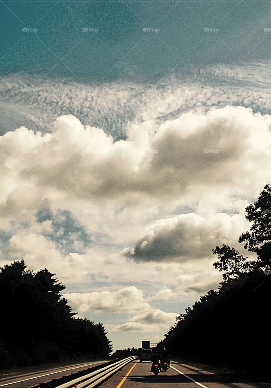 Riding the highway with other motorcycles 🏍Cloud formation.