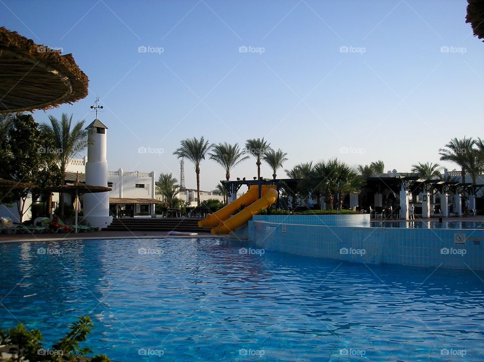 Pool with hills on territory of a hotel