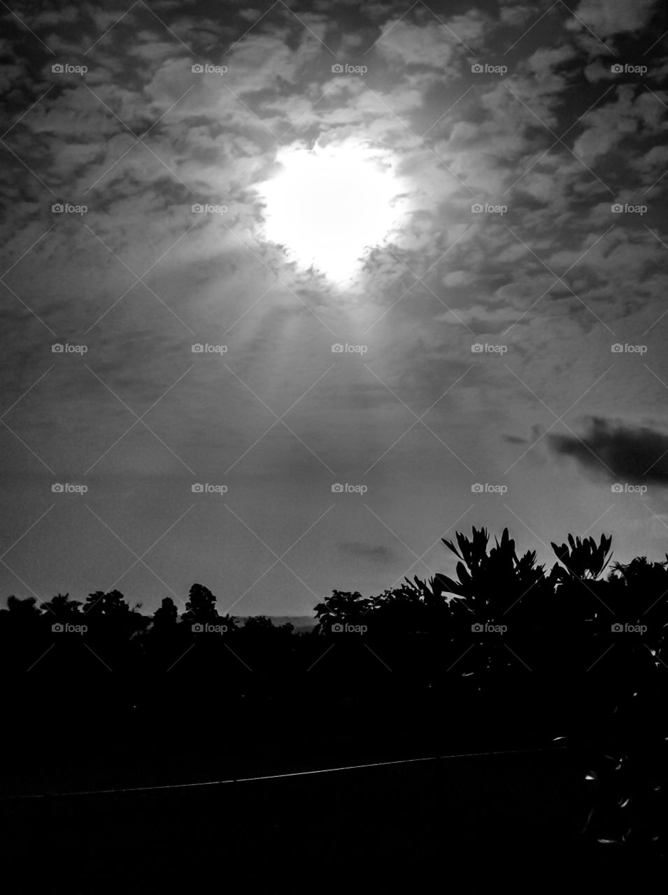 Sunrise. This mornings sunrise. Black and white photo looks like a diamond shape of the sun;) 