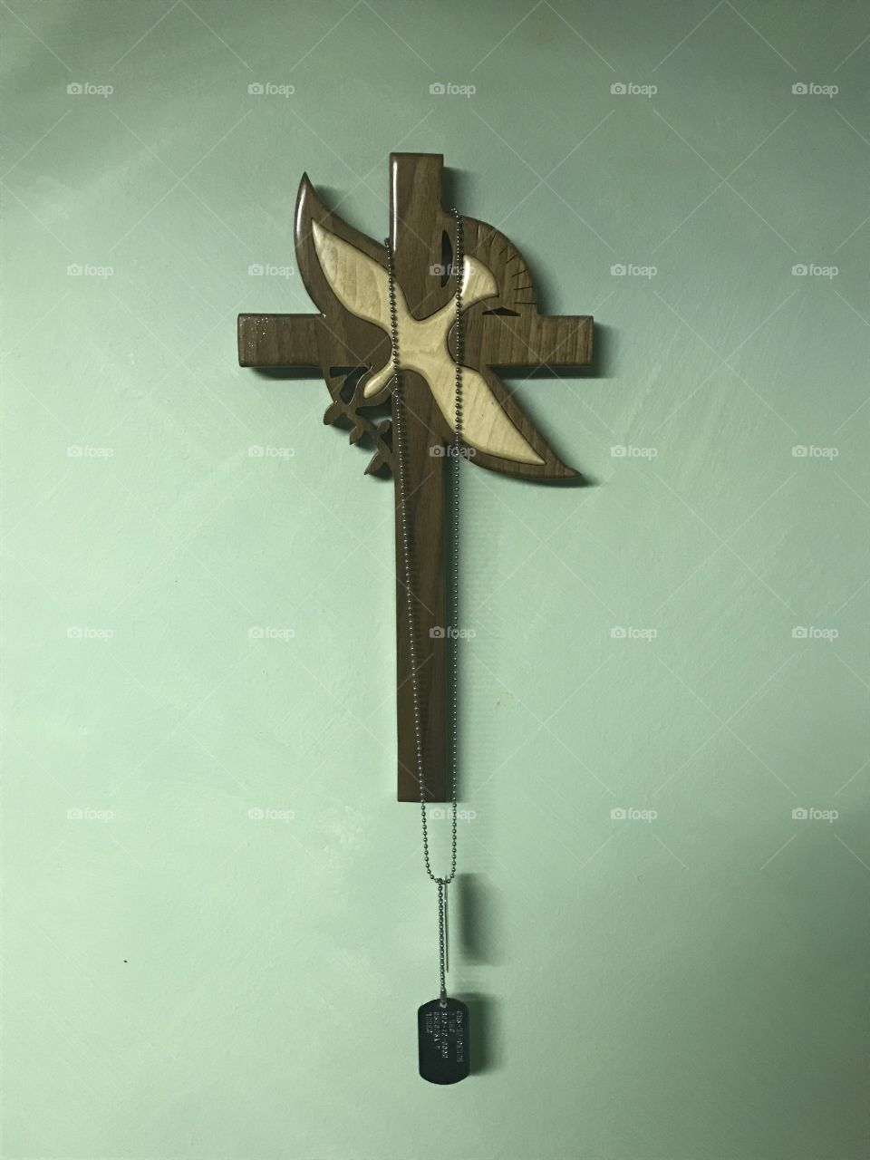Cross with dog tags