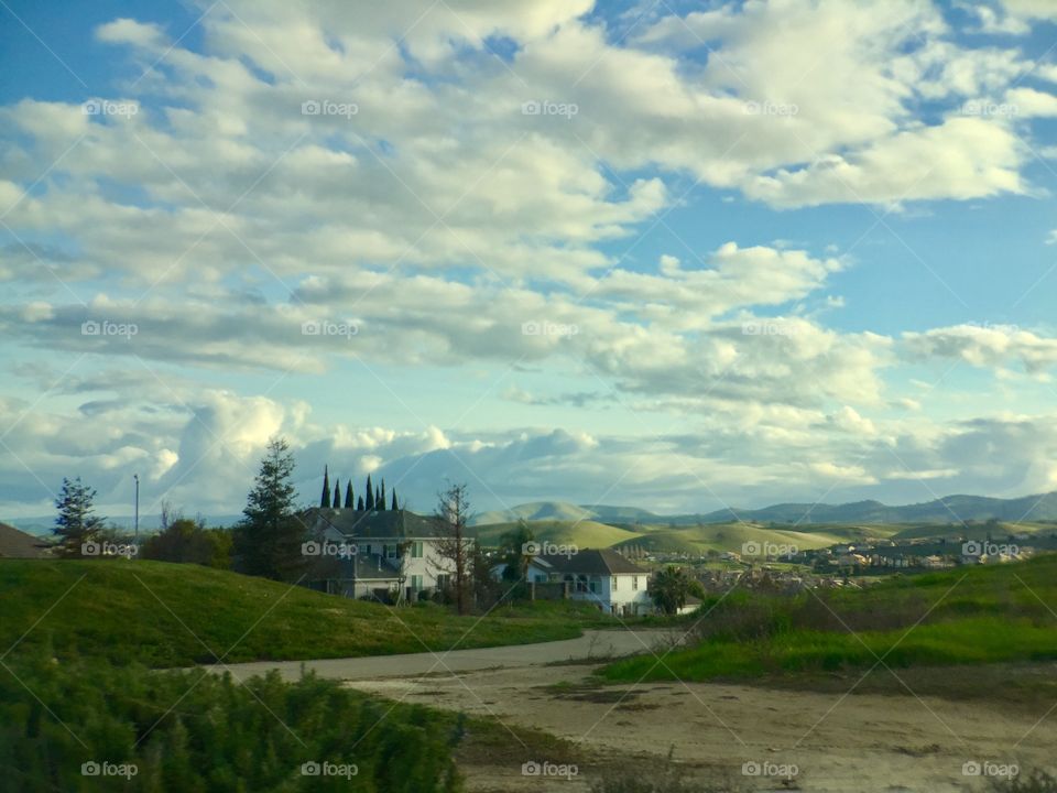 Landscape. Houses. Clouds 