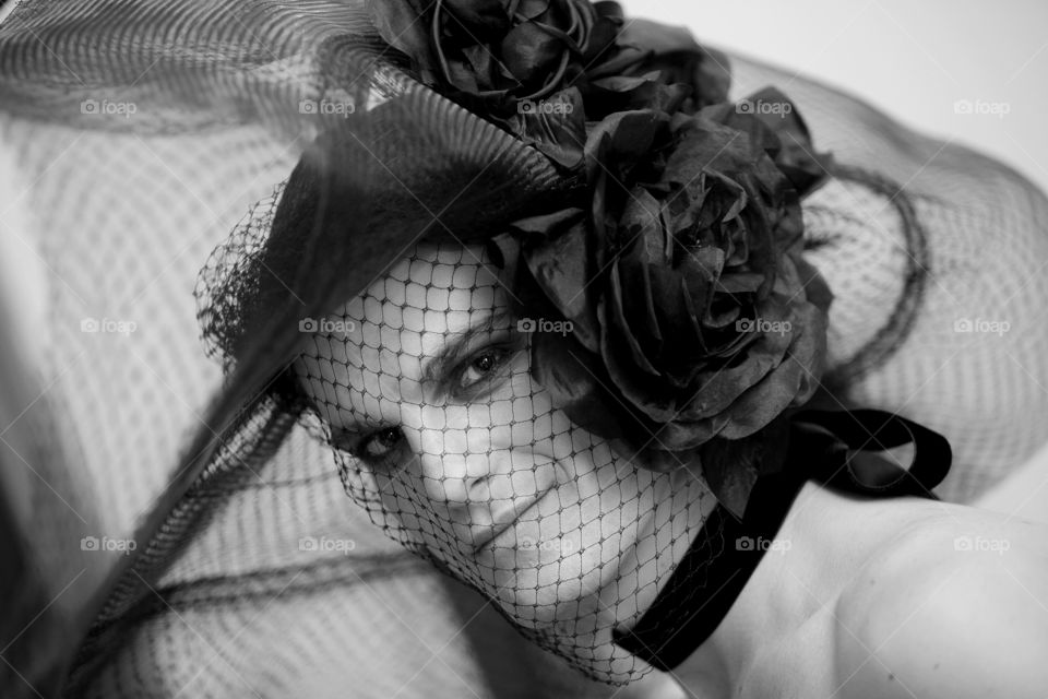 Man presents with female hat in fashion show