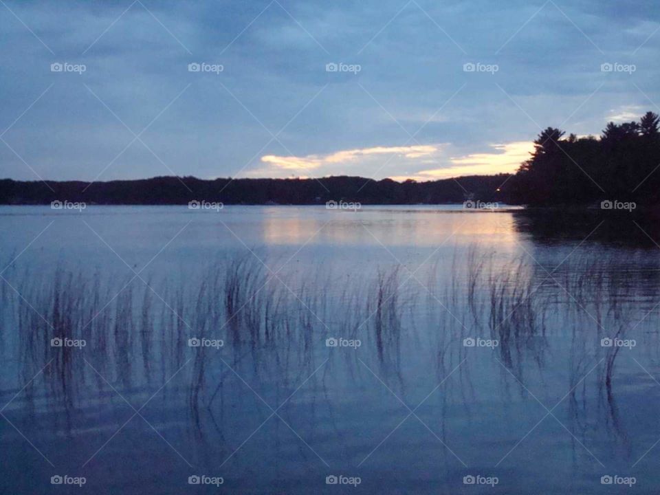 Calm waters at dusk on Lake Ann