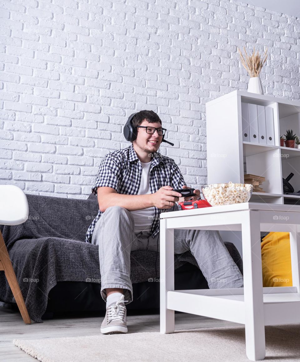 young emotional man playing video games