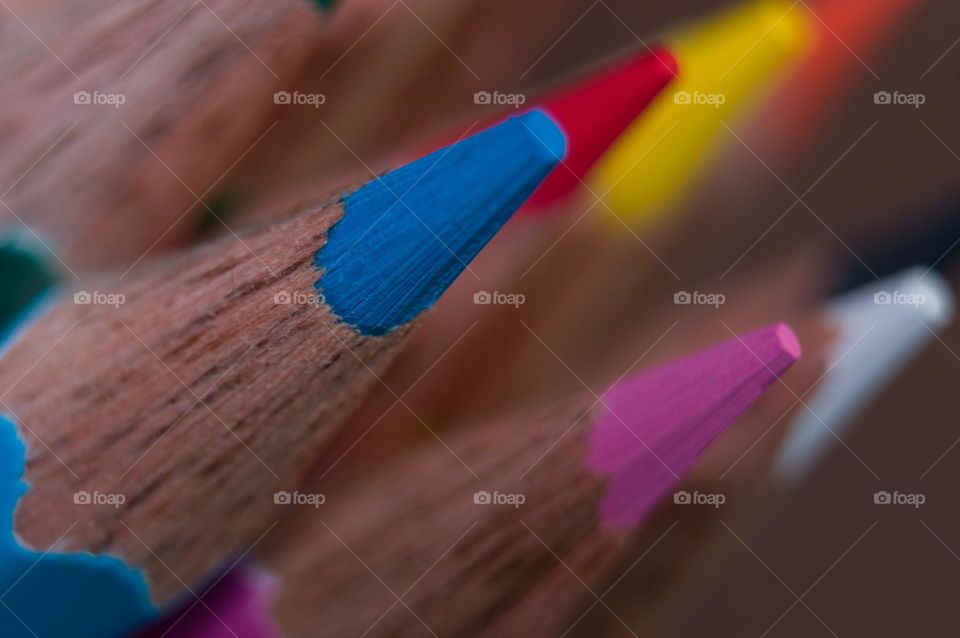 Colorful pencil tops.Blue color in focus. Selective focus.