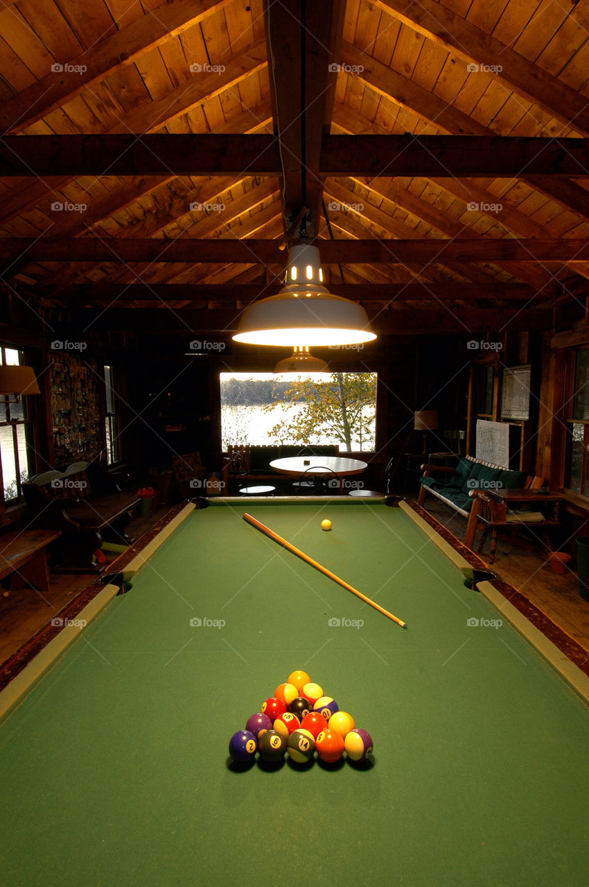 Playing billiards at camp by the lake