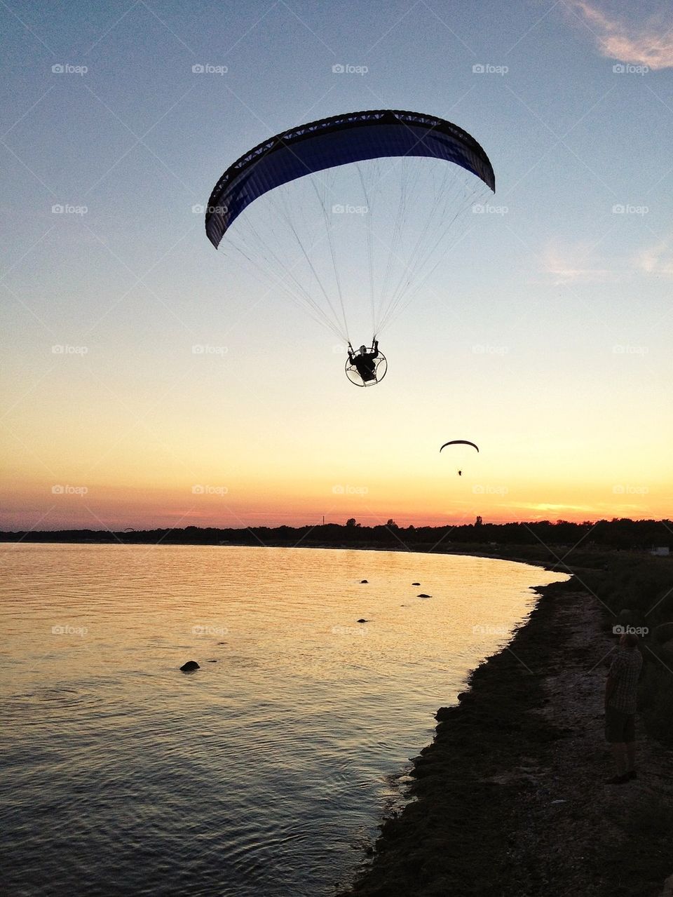 Paragliding along the beach